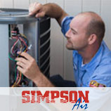 Simpson Air HVAC tech repairing AC unit at a Tampa home