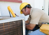 HVAC tech installing an air conditioner at a Tampa home